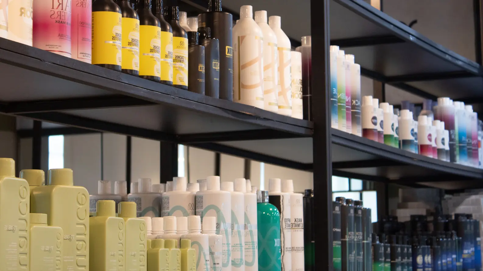 Professional hair salon care products and treatments display on shelf